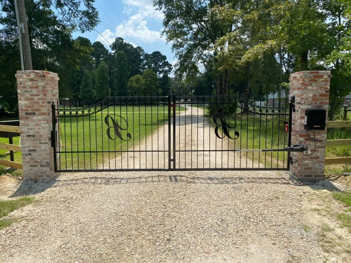 Custom automatic driveway gate installed by Ultimate Technologies
