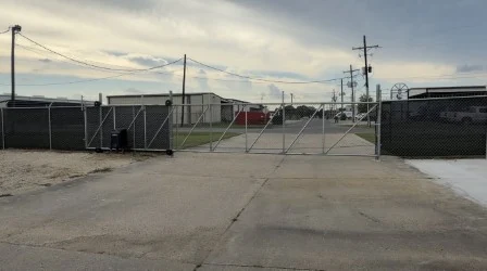 Controlled access gate at an industrial property